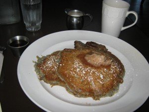 Blue corn buttermilk pancakes with cinnamon butter and maple syrup plus homemade sausage patties